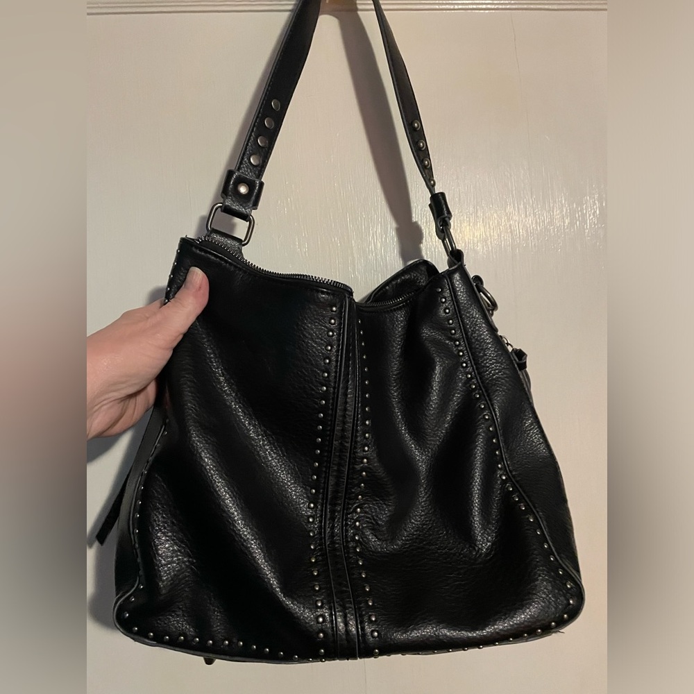 Black studded faux leather bag. Lots of compartments